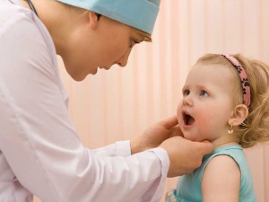 Doctor pediatrician exam baby mouth